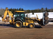 Forax Backhoe Brush Cutter mounted on John Deere backhoe loader clearing roadside vegetation.