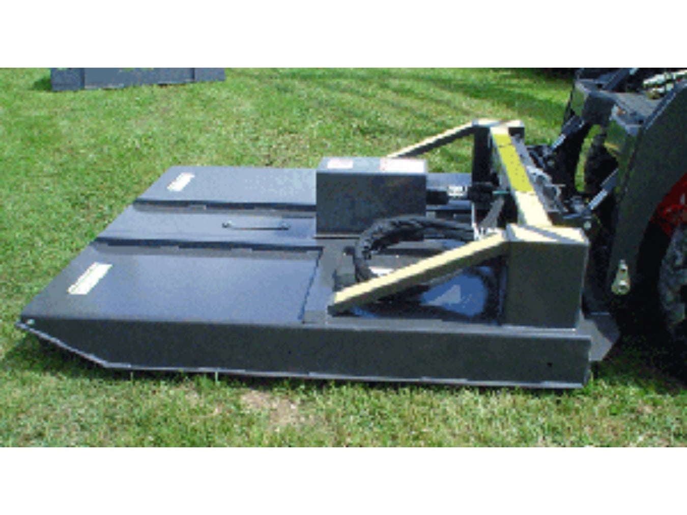 Skid steer brush cutter mowing grass and small trees using Haugen mower