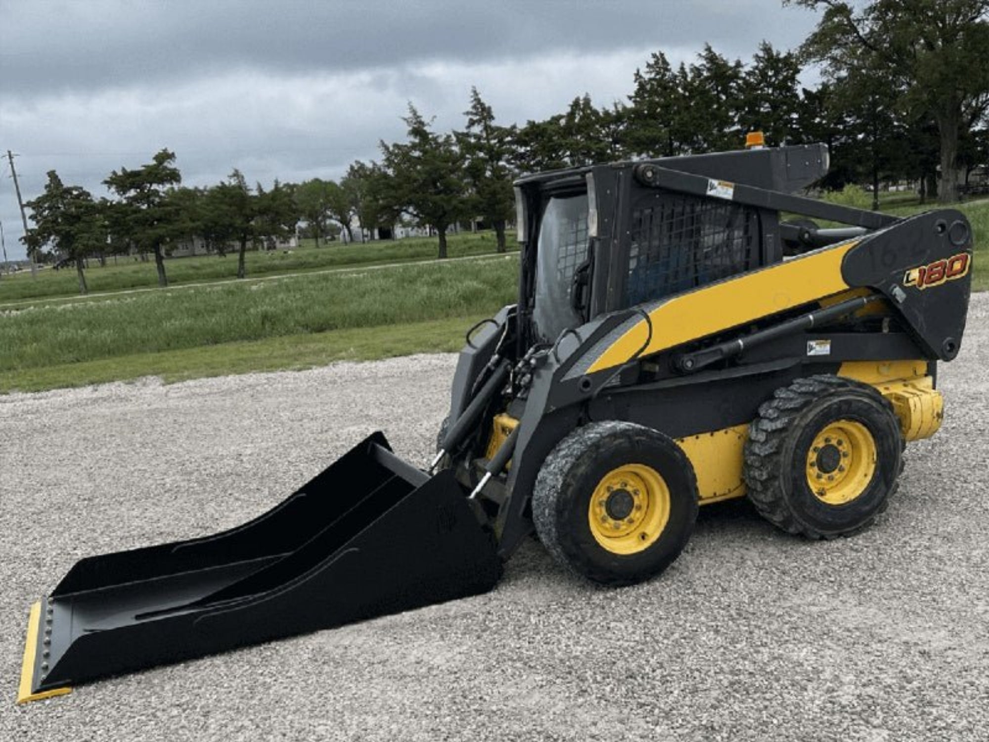 Maxx Conveyor Cleaning Bucket | Skid Steer & Loader Attachment — Landboss